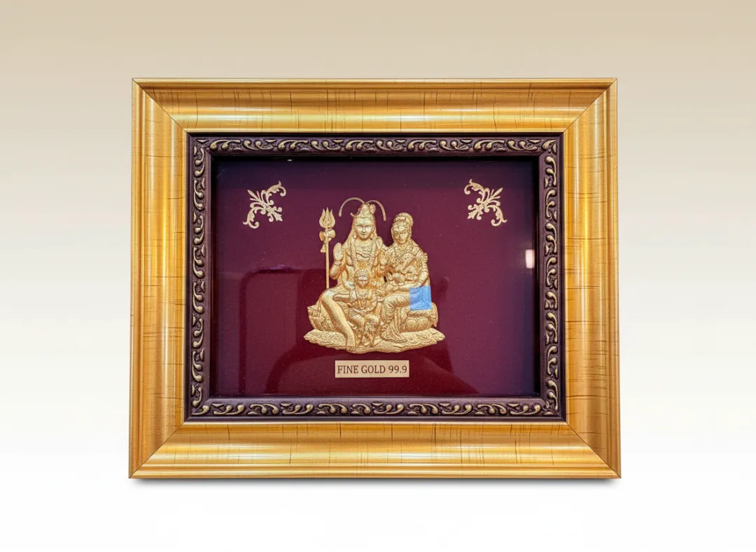 Shiva Parivar Fine Gold 99.9 Frame — Lord Shiva, Parvati and Ganesha in 24K gold foil on maroon velvet with ornate double-layered gold frame | Swarn Shikhar Jewellers Chembur Mumbai
